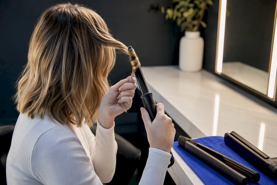 Fine hair styled with two curling tools