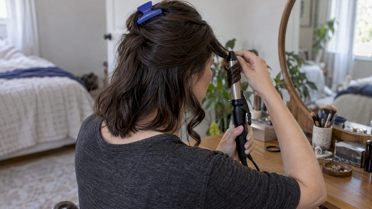 Hair wrapped around a curling iron barrel